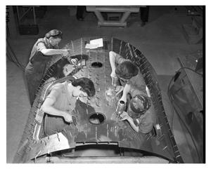 Primary view of object titled '[Four Women Working on the Canopy Section of an Aircraft]'.