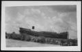 Photograph: [Possibly building a ship. Location unknown.]