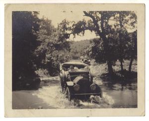 Primary view of object titled '[Pierce-Arrow automobile fording a stream]'.