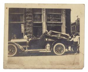 Primary view of object titled '[Pierce-Arrow automobile in front of store]'.