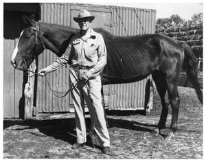 Primary view of object titled 'Dr. R.A. Duncan and his horse, Streak'.