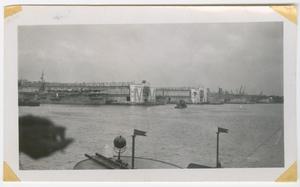 Primary view of object titled '[Aircraft Carrier Tied at Pier]'.