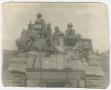 Photograph: [Robert Campbell and Crew Members on a Tank]