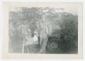 Photograph: [Soldier in Front of Jeep]
