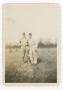 Primary view of [Jerry Merkle and Vern Thomas on a Field]