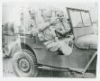 Photograph: [General and Soldiers in Jeep]
