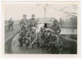 Photograph: [Eight Soldiers Posing on a Bridge Over the Danube River]