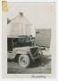 Photograph: [Soldier Beside a Jeep]