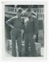 Photograph: [Two Soldiers in Front of Statue]