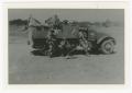 Photograph: [152nd Signal Company Men with Half-Track]