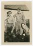 Photograph: [Three Soldiers Posing in Front of a House]