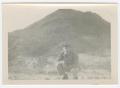 Photograph: [William Giannopoulos Crouching in Front of a Mountain]