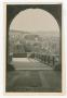 Photograph: [Archway Overlooking a City]