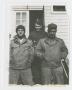 Photograph: [Three Soldiers Standing in Front of Camp Campbell Dayroom]