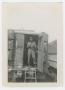 Photograph: [Soldier Standing in Doorway of a Maintenance Van]
