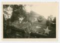 Photograph: [Man in Front of Tank]