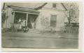 Postcard: [Family on a House's Porch]
