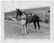 Primary view of Mildred Farris and her Champion Barrel Racer