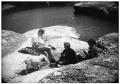 Thumbnail image of item number 1 in: 'Group Lounging by A Lake'.