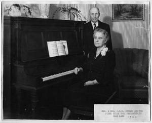 Primary view of [Rev. & Mrs. J.W.W. Shuler and a piano]