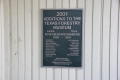 Photograph: [Plaque Listing Additions to Forestry Museum]