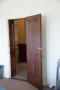 Thumbnail image of item number 1 in: '[Photograph of an Open Wooden Door]'.