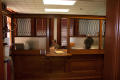 Primary view of [Woman Behind Desk]
