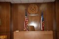 Photograph: [Flags Behind Judge's Bench]