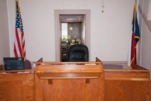 Primary view of object titled '[Chair Behind Judge's Bench]'.