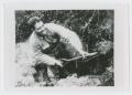 Photograph: [Soldier Digging a Hole]