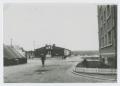 Photograph: [Soldier Walking Down Road]
