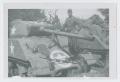Photograph: [Soldier Standing on Tank]