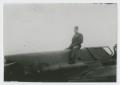 Photograph: [Man on Top of Airplane]