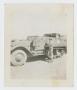 Photograph: [Soldier Standing by Half-Track]