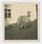 Photograph: [Soldier Kneeling by Wood Pile]
