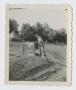 Photograph: [Killigrew Holding a Gas Can]