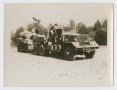 Photograph: [Truck With Tank Behind It]