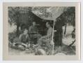 Photograph: [Soldiers Sitting Under Tent]