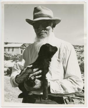 [Photograph of Frank Duncan Holding a Baby Goat]
