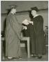 Photograph: [Concordia Graduate Shaking Hands with a Faculty Member]