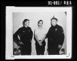 Photograph: [Oswald with Officers #1]