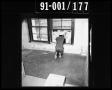 Photograph: Man Looking Out of Window in the Texas School Book Depository