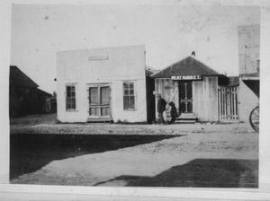 Primary view of object titled '[The City Café and Meat Market in Needville, Texas.]'.