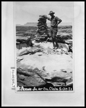 Primary view of object titled 'Man by Oil Claim Marker'.