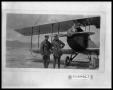 Photograph: Two Men in Aviator Clothing by Bi Plane