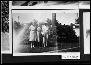 Primary view of object titled 'Women and Man in Yard'.