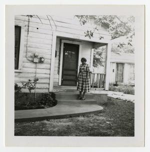 Primary view of object titled '[S. A. Winn Standing on a Porch]'.
