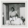 Photograph: [Young Woman Preparing Food]