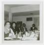 Photograph: [Group at Dinner]