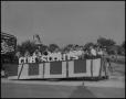 Photograph: [Photograph of Cub Scouts Float in Rodeo Parade]